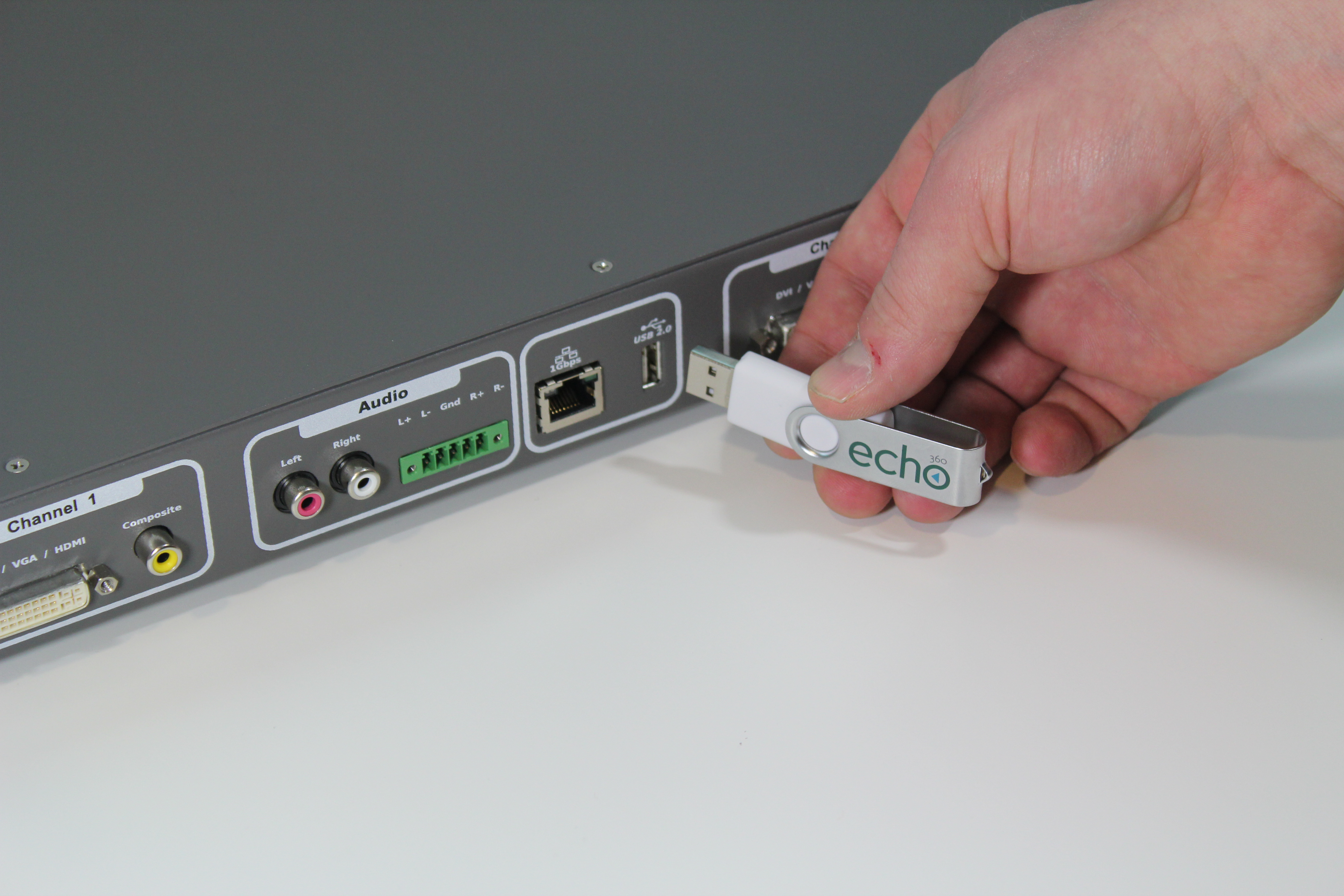 Picture of USB drive being plugged into back of SafeCapture appliance.