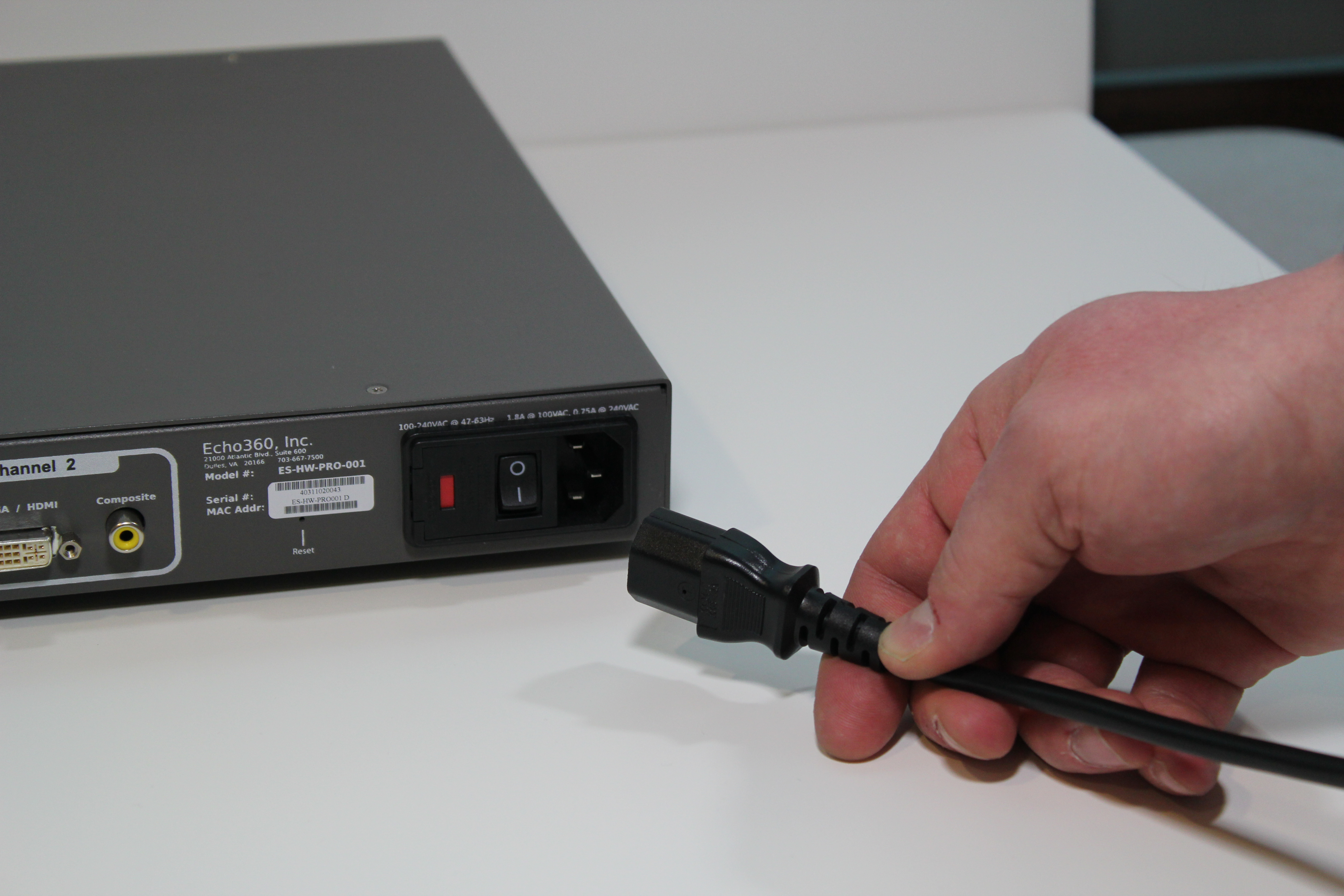 Picture of power cord being plugged into SafeCapture HD device.